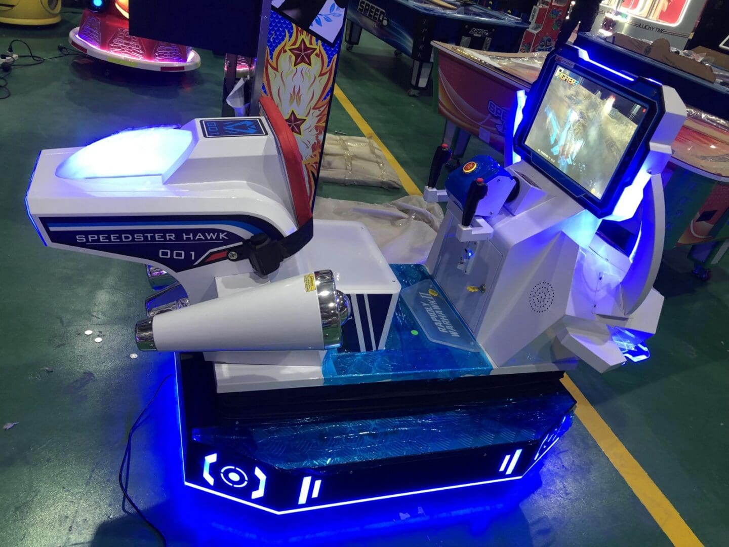 A blue and white arcade machine with lights